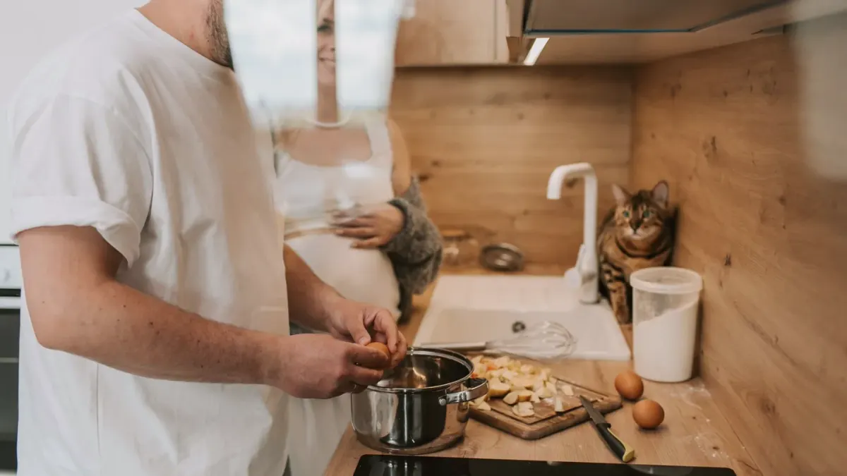 Dog owner preparing a meal