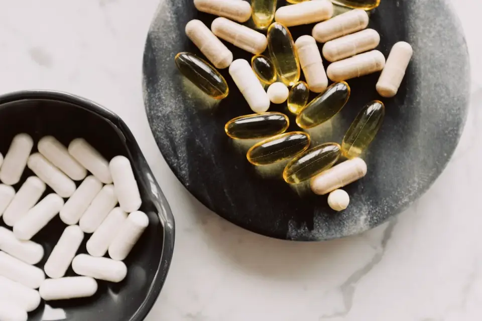 Joint supplement chews arranged on a kitchen counter next to a water bowl